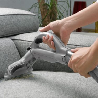 vacuuming sofa