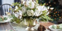 Holiday centerpiece of white flowers