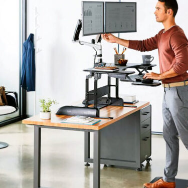 Man Increasing his Circulationat a standing Desk