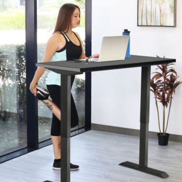 Skinny woman working at Standing Desk