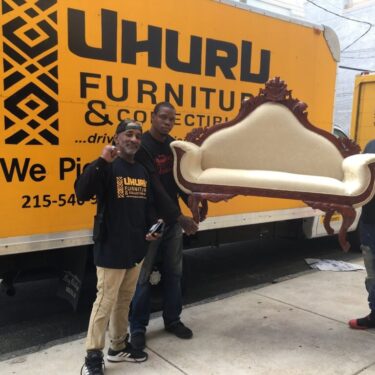 People picking up old furniture for donation