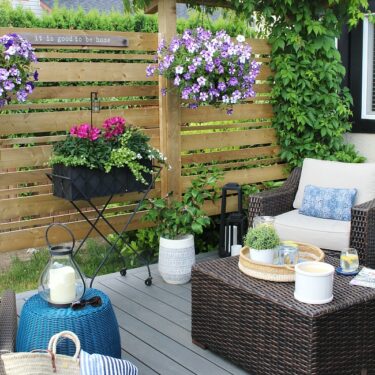 Outdoor space next to fence decorated with flowers