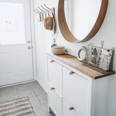 Entryway with narrow cabinet and mirror