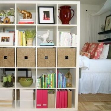 Storage wall used to enclose bedroom in small space