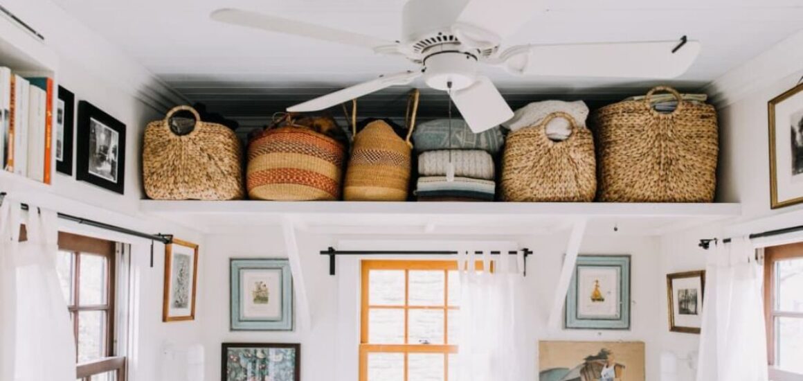 Shelves hung up close to ceiling for small space storage